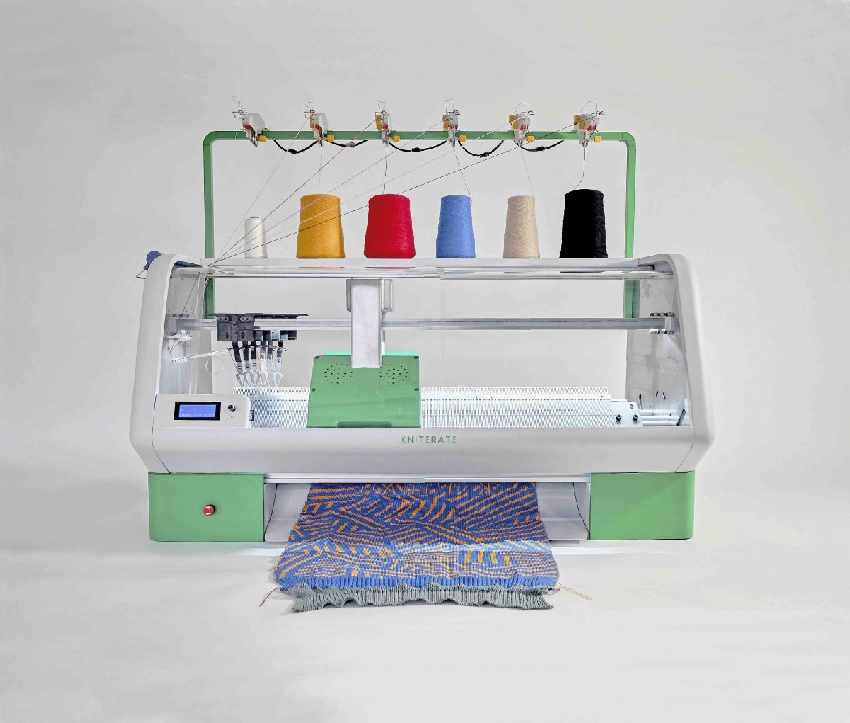 Sustainable textile startup Kniterate has produced a compact knitting machine for communities.