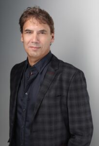 Paul McKenzie, CEO at NexOptic