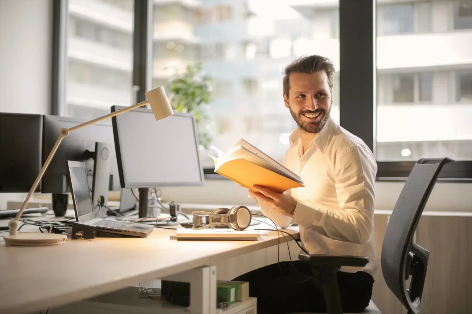 what-office-space-best-startup-man-smiling-desk
