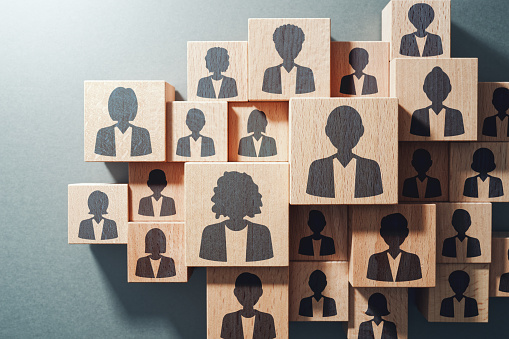 Top view of various wood cubes with people icons HR