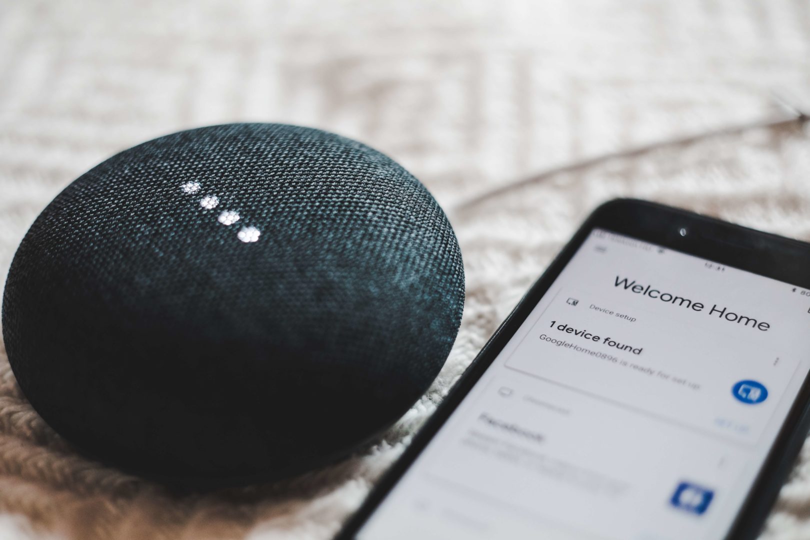mobile-phone-next-to-smart-home-device