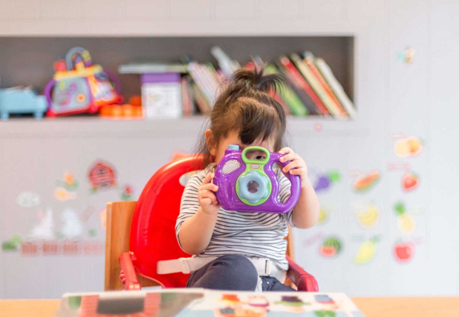 child-holding-camera-social-media