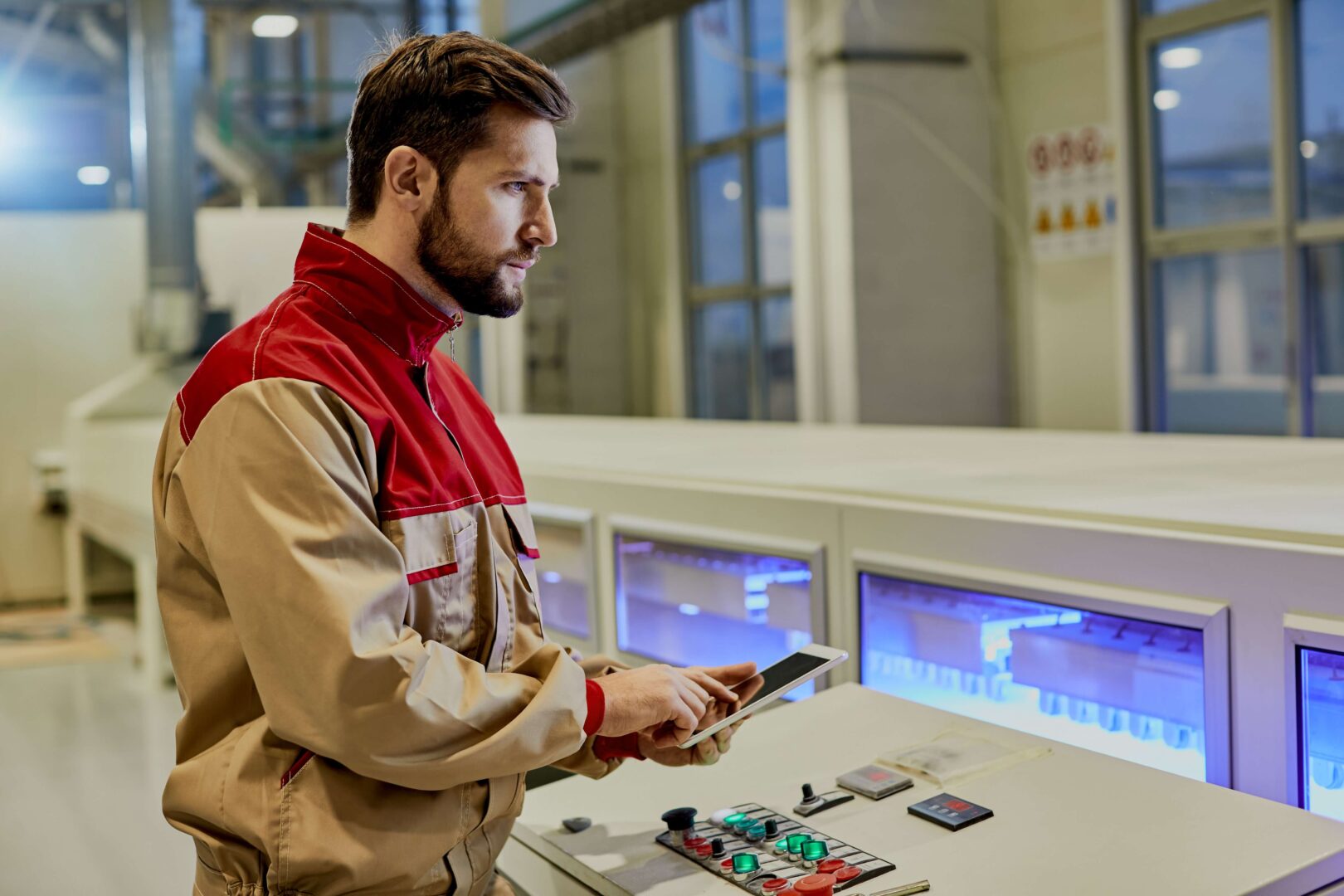 Man over control panel
