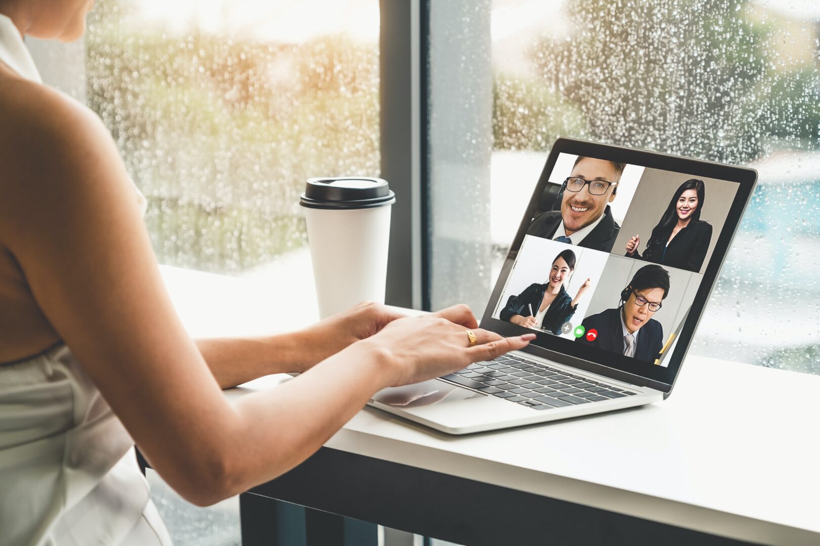 online meeting laptop with coffee
