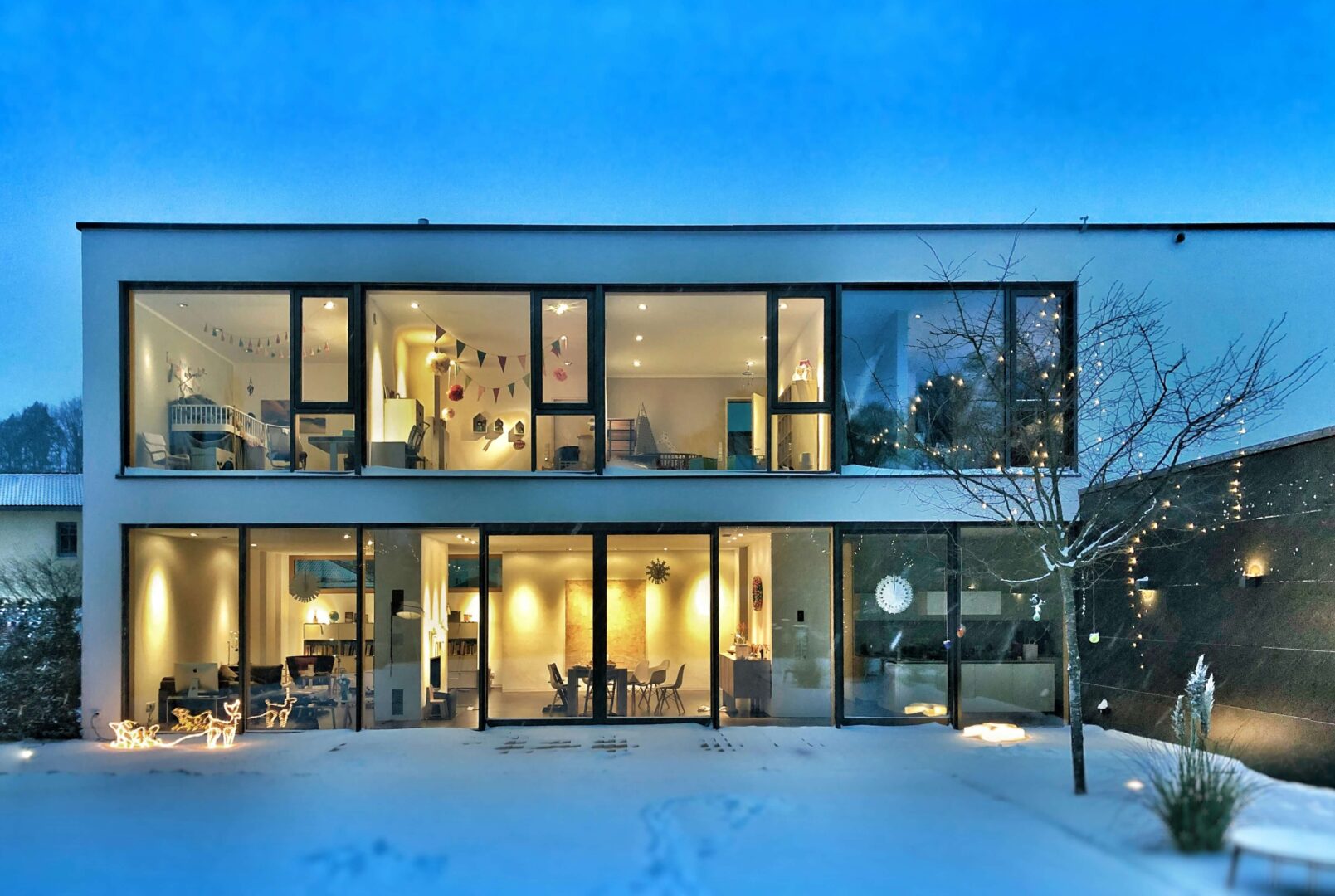 Modern home with lights on