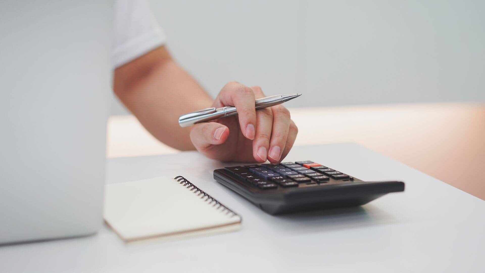 Payroll Specialist Calculating Numbers