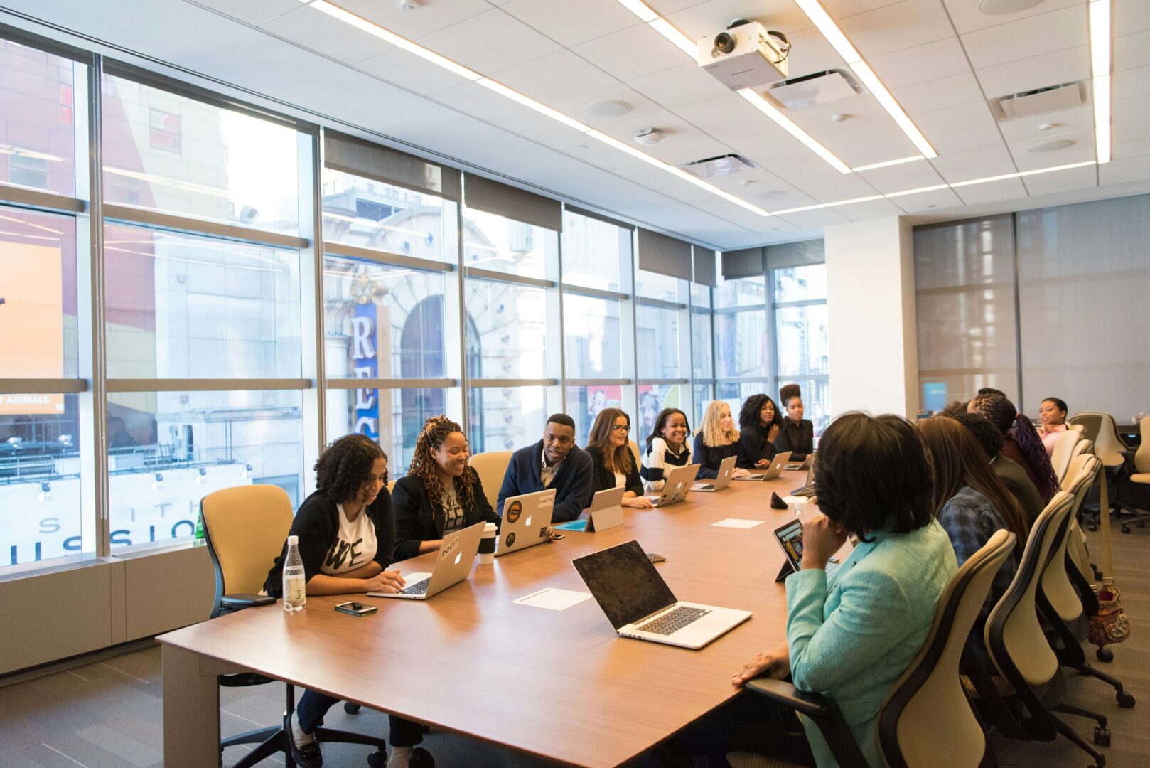 Photograph of executives sitting in a boardroom.