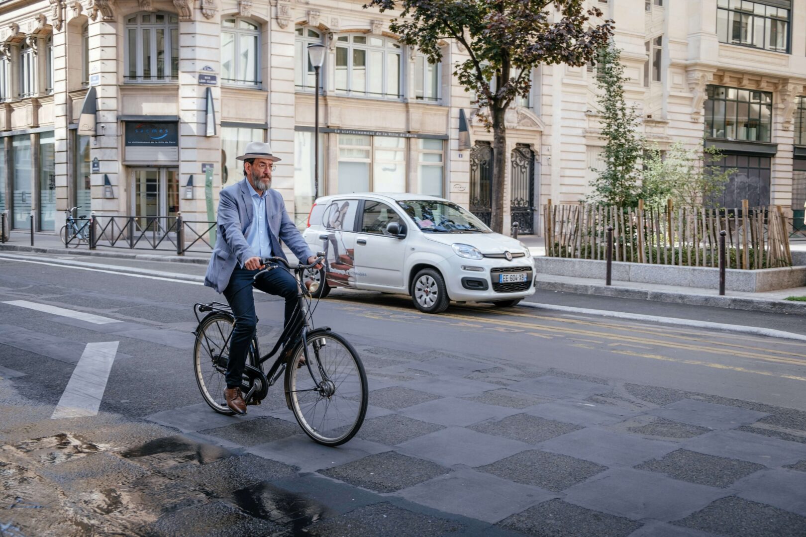 Photograph of a French man on a bicycle