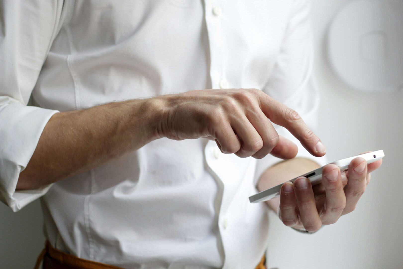 man-working-on-cell-phone