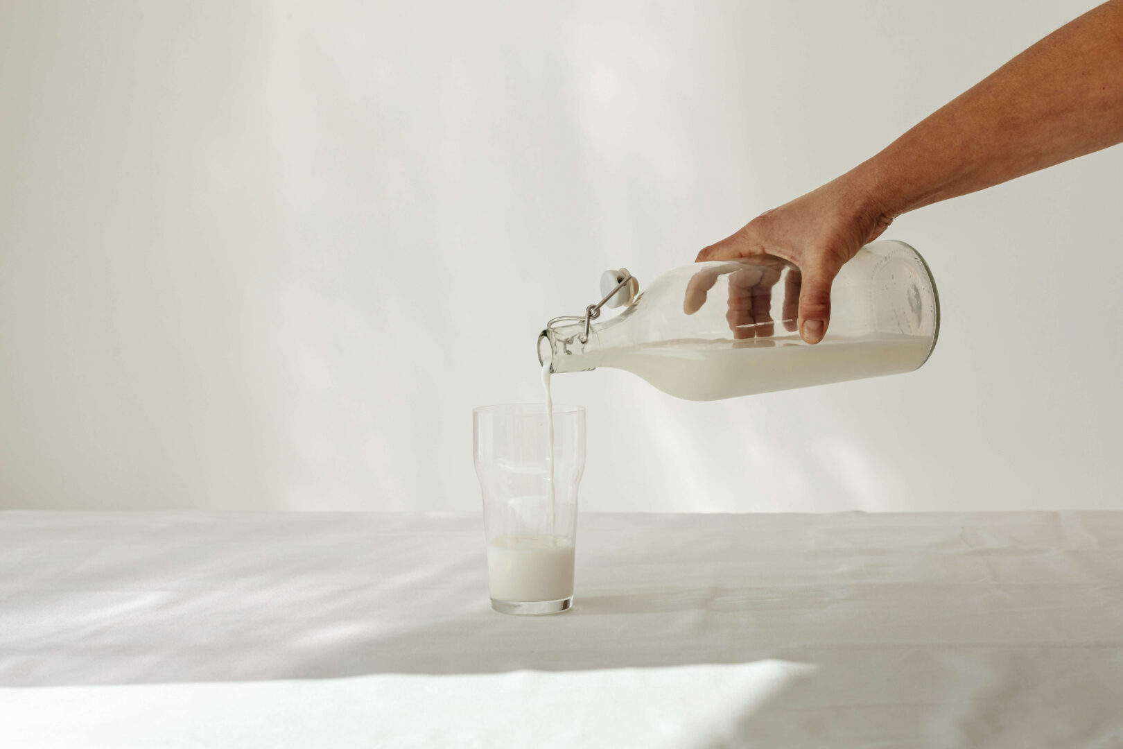 Milk being poured in glass