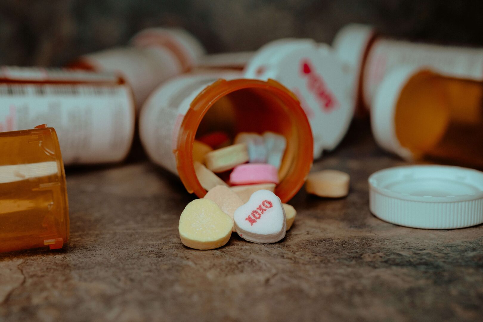 Photograph of a pill bottle with pills spilling out