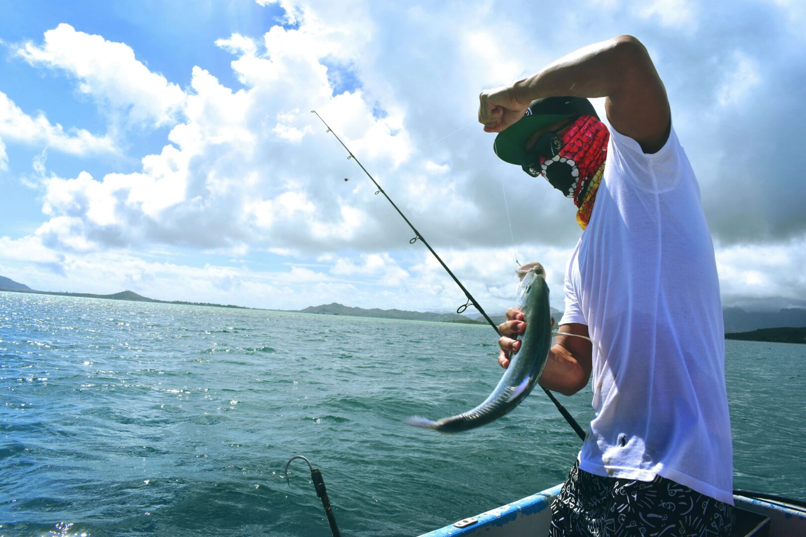 photograph-of-man-catching-fish