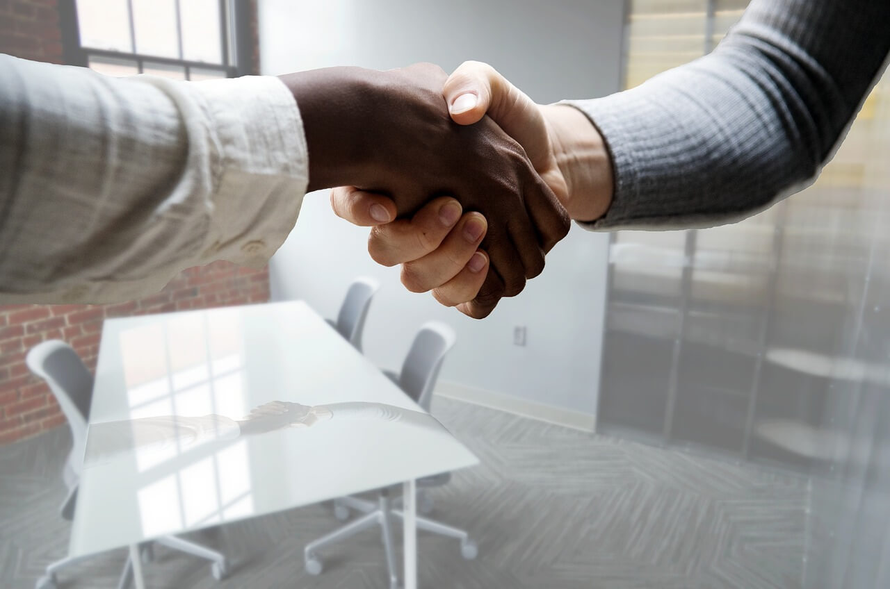 photogrpah-of-employees-shaking-hands