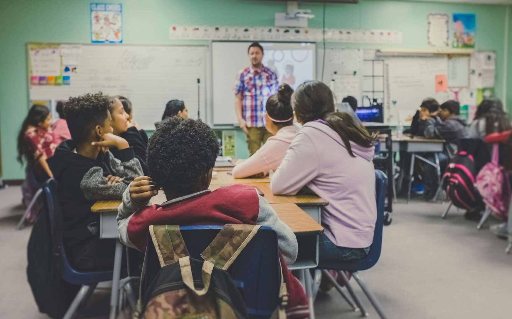 photograph-of-teens-sitting-in-a-classroom-scaled