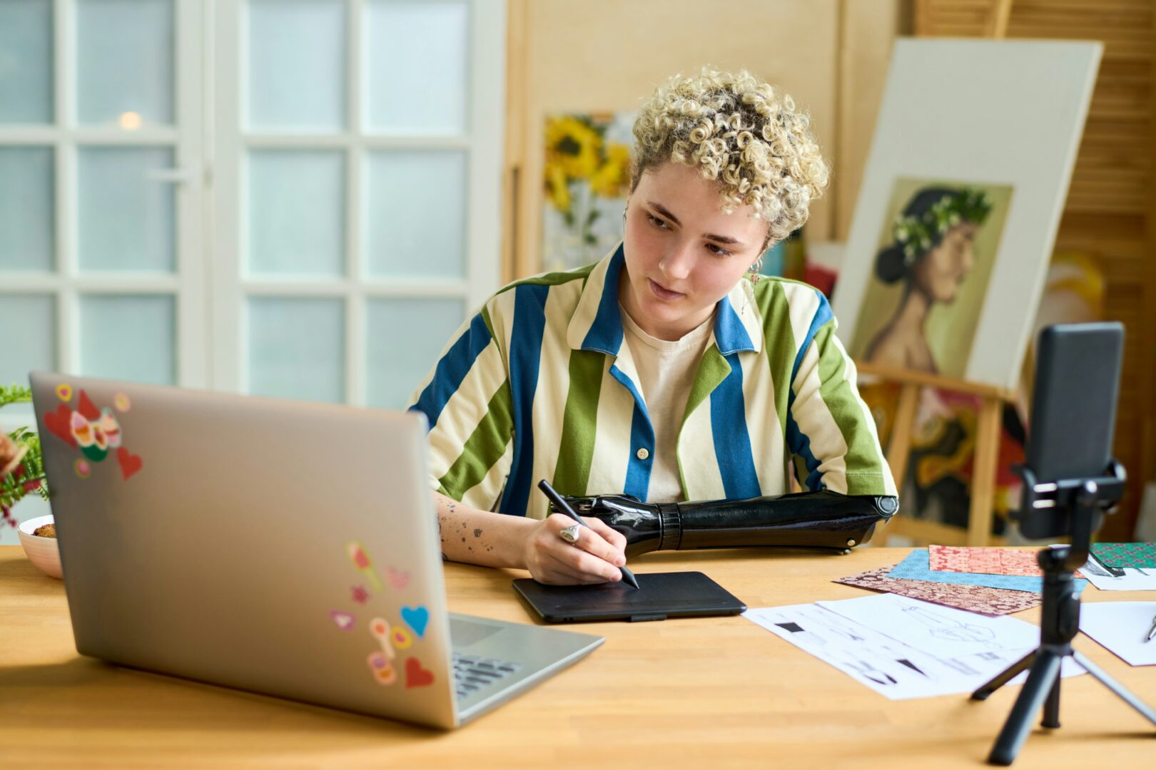 Woman sitting at her desk working on her laptop