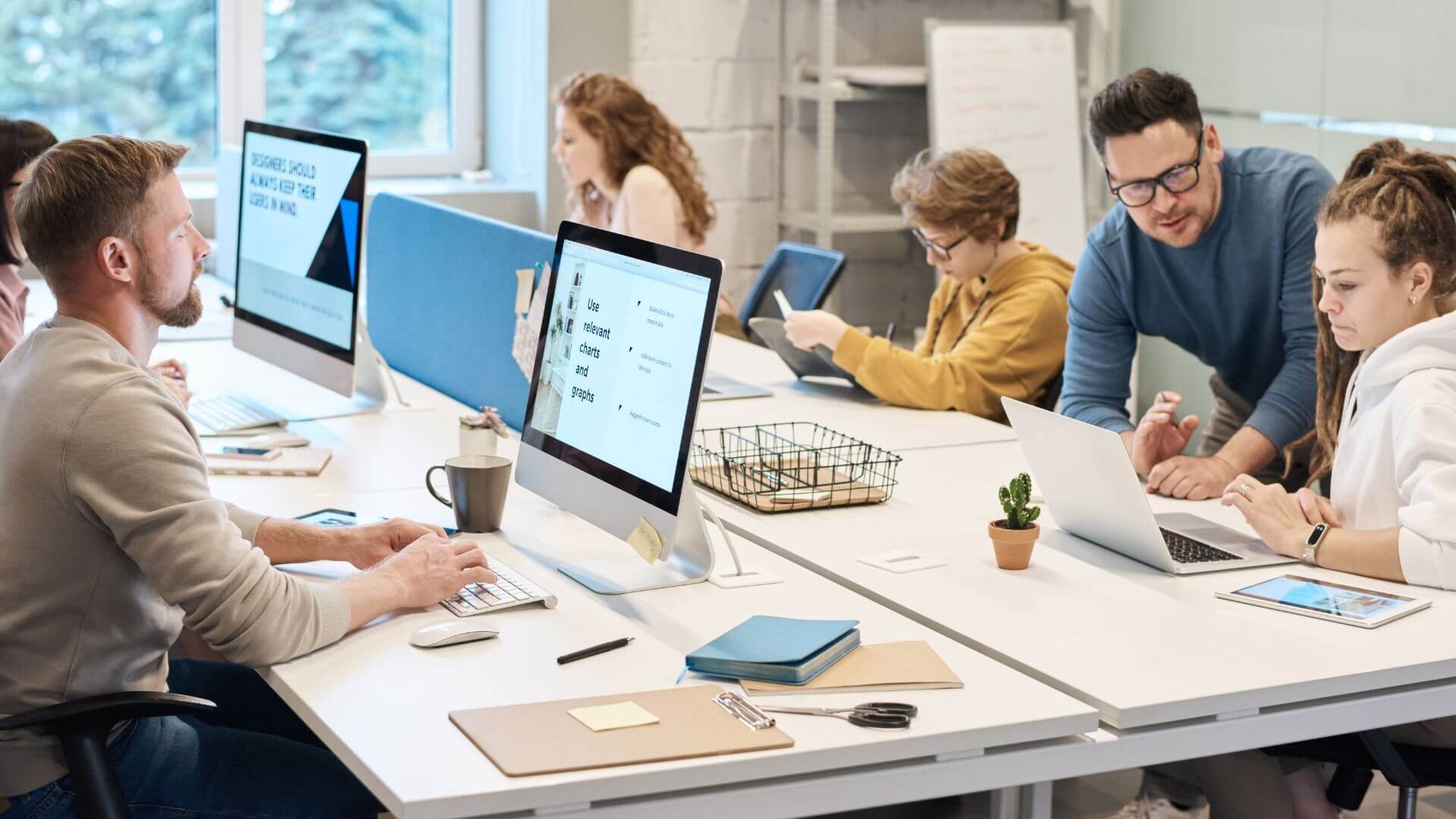Employees At A Desk