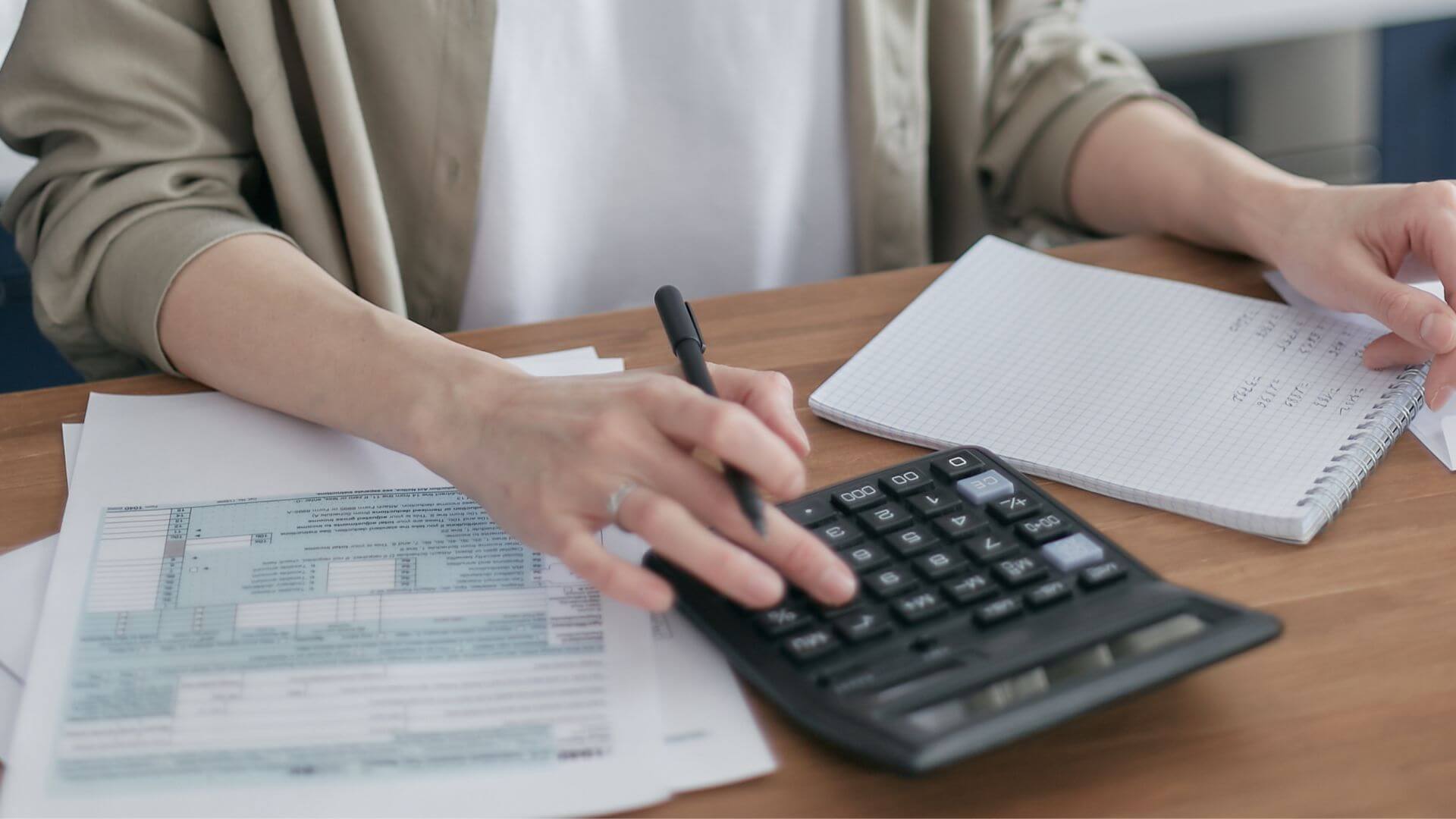 Woman Calculating Salaries