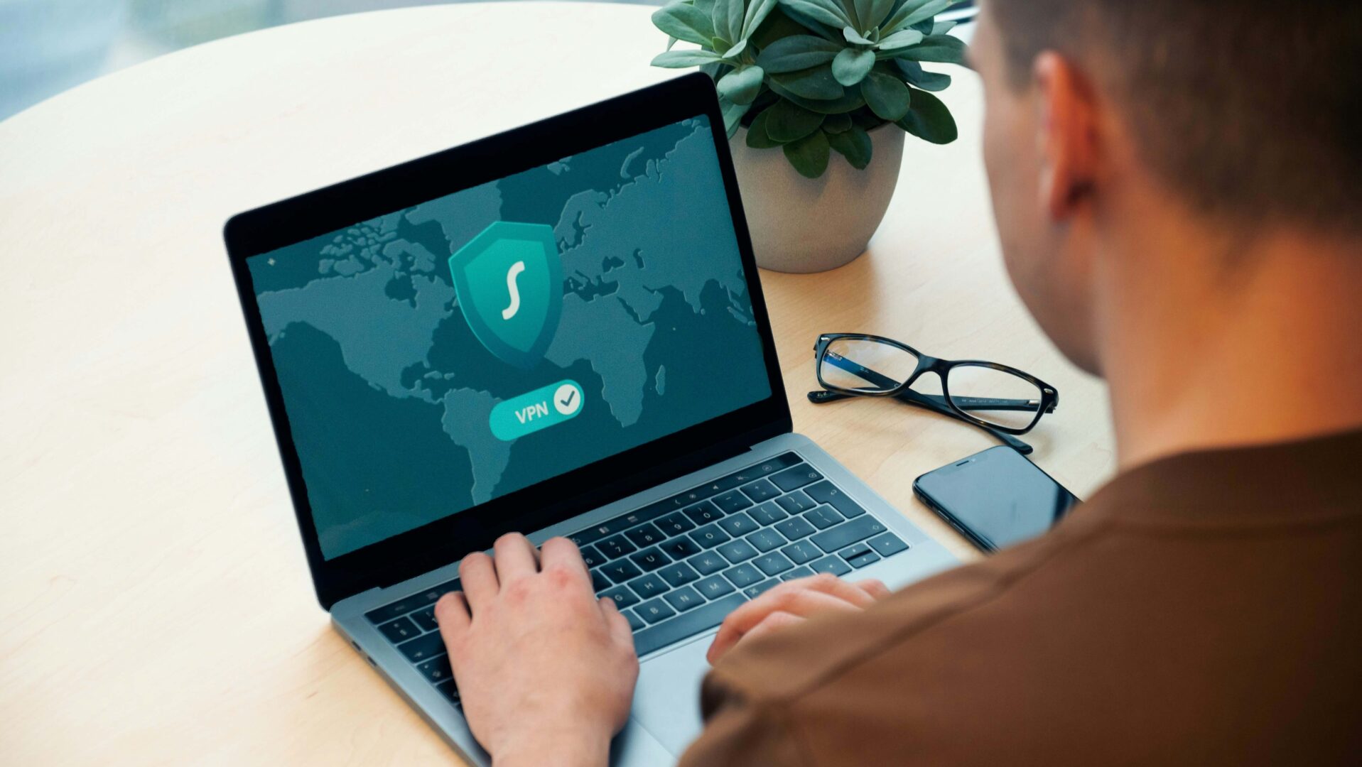 man-connecting-to-a-vpn-on-a-laptop