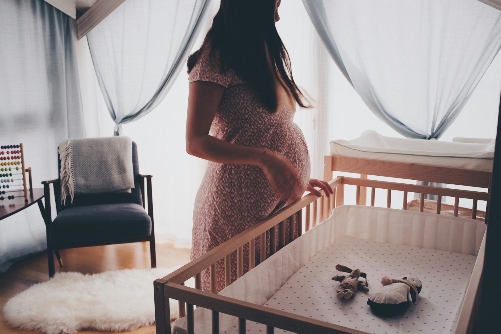 woman-baby-crib
