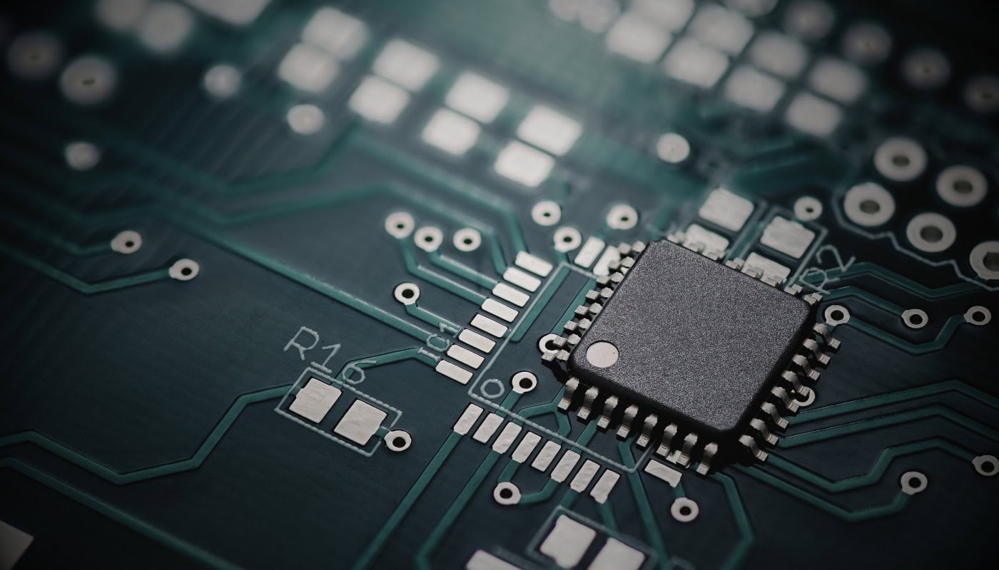 A close-up of a semiconductor circuit board representing the UK government’s £1.1 billion investment in AI hardware, semiconductor chip design and engineering training announced during London Tech Week 2026, aimed at strengthening British capability in the global chip supply chain.